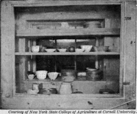 Fig. 117.   These shelves inside a window give a place for cooling food. Netting must be used to keep out flies.