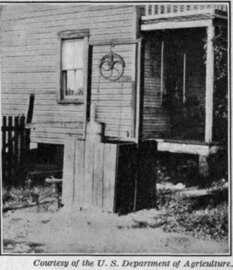 Fig. 7.   An old fashioned open well is subject to surface wash.