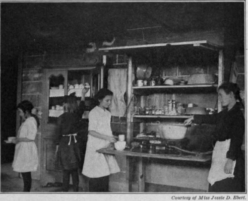 Fig. 70.   Cooking a cereal at the Big Tree School.