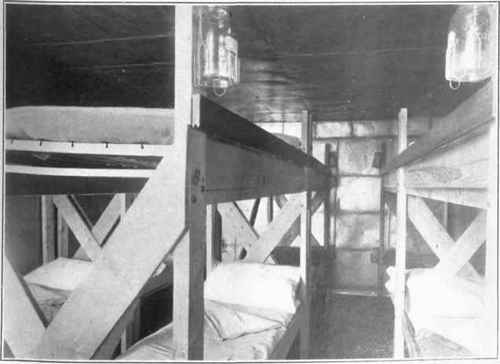 Interior of group respiration chamber showing arrangement of beds in 3 sections of 4 each.