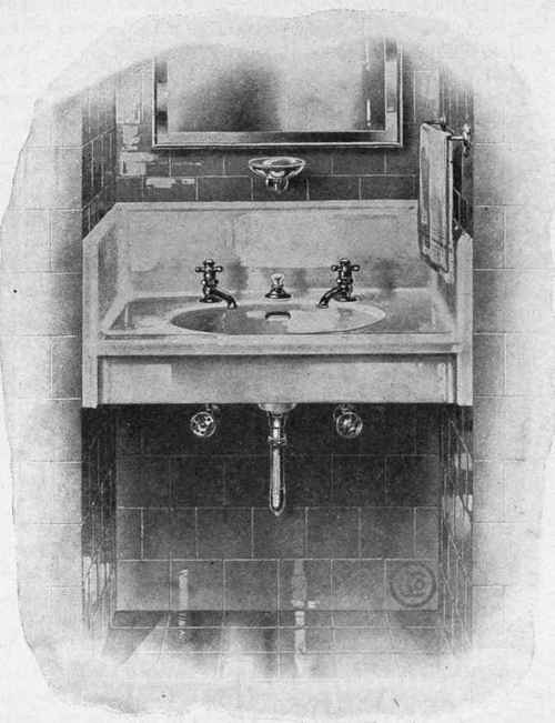 Fig. 23. Solid Porcelain Lavatory with Solf Closing Basin Faucets and Direct Lift Waste