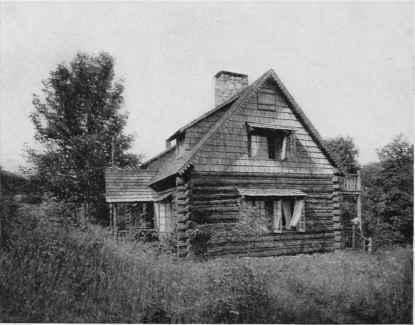 Where Timber is Abundant, the Log House is Appropriately Placed.