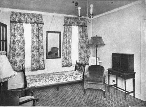 The side hangings are here so wide as to rob the window treatment of a dominant element.