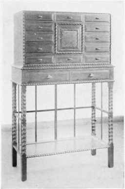 A CABINET IN EBONY DESIGNED AND MADE BY P. WAALS, CHALFORD, ENGLAND.