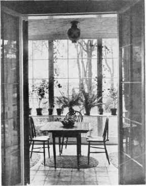 A SMALL, INEXPENSIVE ENCLOSED PORCH.