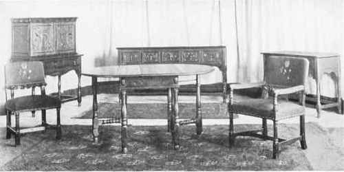JACOBEAN 10 PIECE DINING SU1TE IN ANTIQUE BROWN WALNUT.
