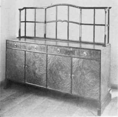 SIDEBOARD IN BURRIED ELM AND EBONY.