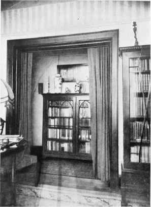 THE FURNISHING OF A NARROW APARTMENT HALL SEEN FROM THE RECEPTION ROOM.