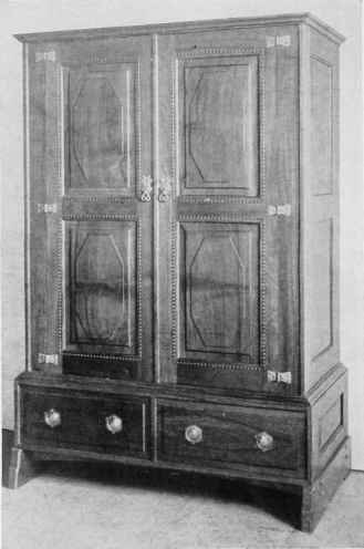 WARDROBE IN WALNUT, DESIGNED BY THE LATE ERNEST W. GIMSON.