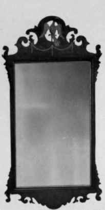 Looking Glass with mahogany inlaid and gilt frame, about 1790.