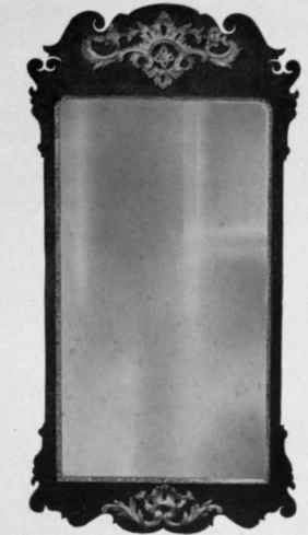 Looking Glass with walnut and gilt frame, 1725 50.