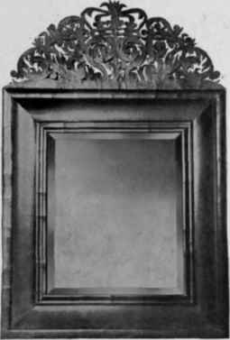 Looking Glass with walnut frame, about 1710.