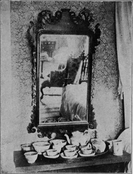 CARVED AND GILDED MIRROR FRAME.