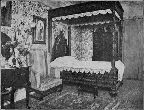 CARVED OAK BEDSTEAD.