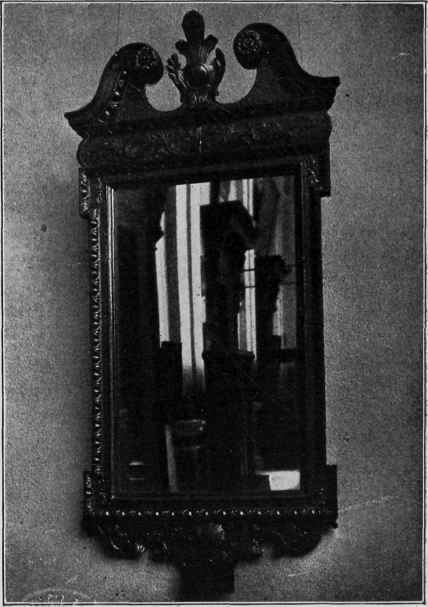 MAHOGANY MIRROR FRAME WITH BRASS ORNAMENTS.