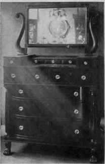 Bureau, Pillar Front, Paw Feet, Swell Front Drawers and Swung Mirror.