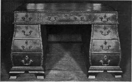 CHIPPENDALE BOMBE MAHOGANY WRITING TABLE.