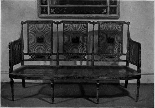 SHERATON PAINTED SATINWOOD AND CANED SETTEE.