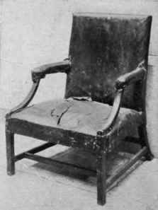 Square Upholstered Back, Straight Arms, Single Curve Supports.