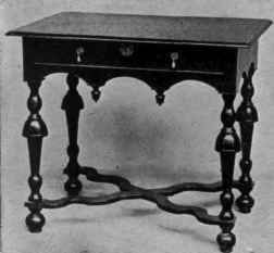 Table, with flat arches and pendent ornaments.