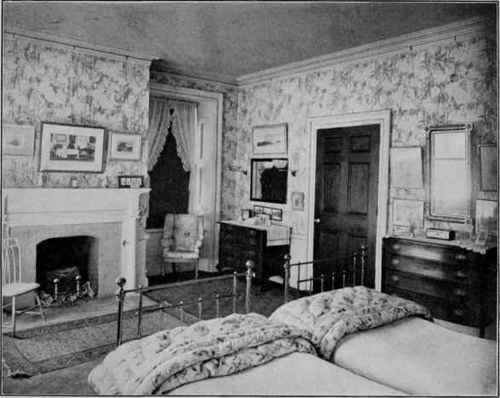 A BEDROOM WITH TWIN BRASS BEDS