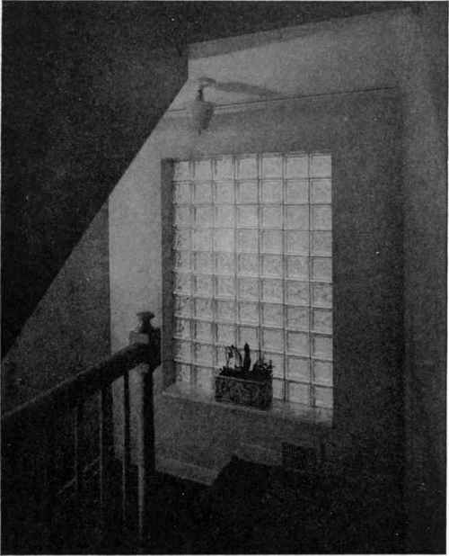 A stair landing can be a dangerous spot in any home, but it loses the hazard and acquires quite a bit of interest when it is lighted by a glass block panel