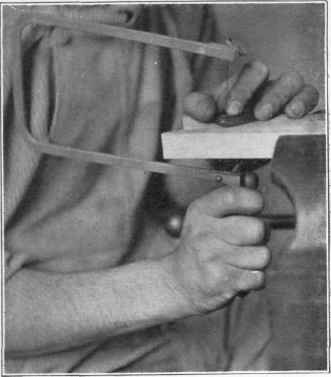 Fig. 115. Using a coping saw.