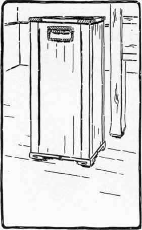 Fig . 16. Basket with plain copper handles and corner braces and with feet of carved blocks.