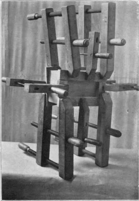 Fig. 192. Gluing the top on to the box.
