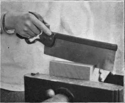 Fig. 193. Sawing the box apart.