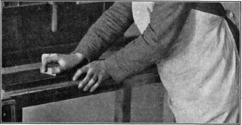Fig. 100.   Method of Grasping Sandpaper.