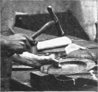 Fig. 2. Raising a dish on a wood mould.