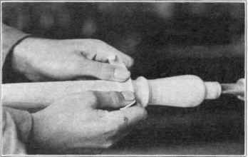 Fig. 26. Sandpapering.