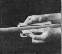 Fig. 27. Sandpapering with Both Hands.