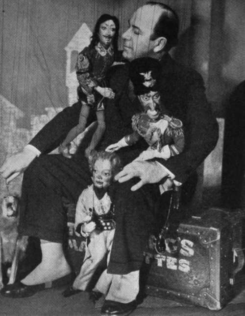 A Master Puppeteer With Some Of His Folks