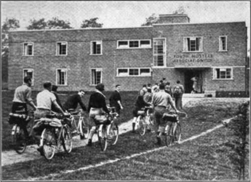 English Cyclists Arrive At A Youth Hostel