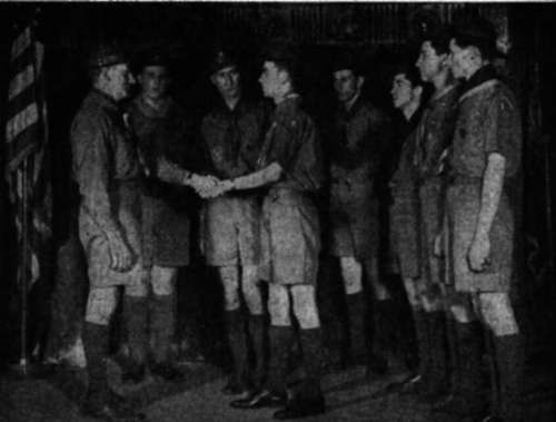 At the Reunion, the Scoutmaster greets