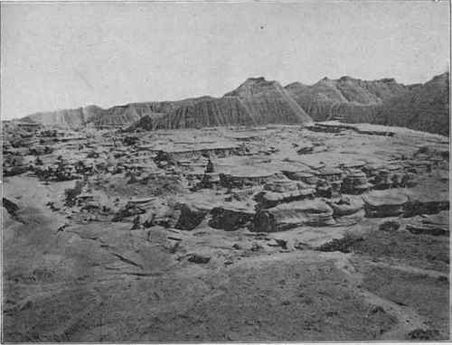 Bad lands near Adelia, Nebraska. The rock in the middle distance is sandstone formed in a stream channel.