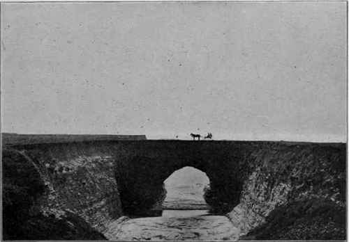 Wave cut arch, coast of California. (U. S. G. S).