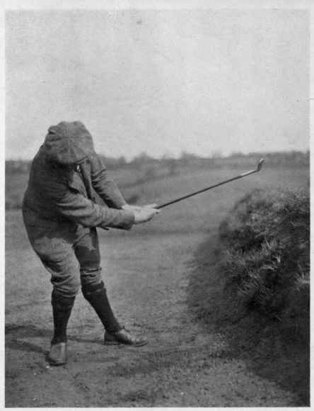 Finish of the niblick shot, with the club remaining in the soil